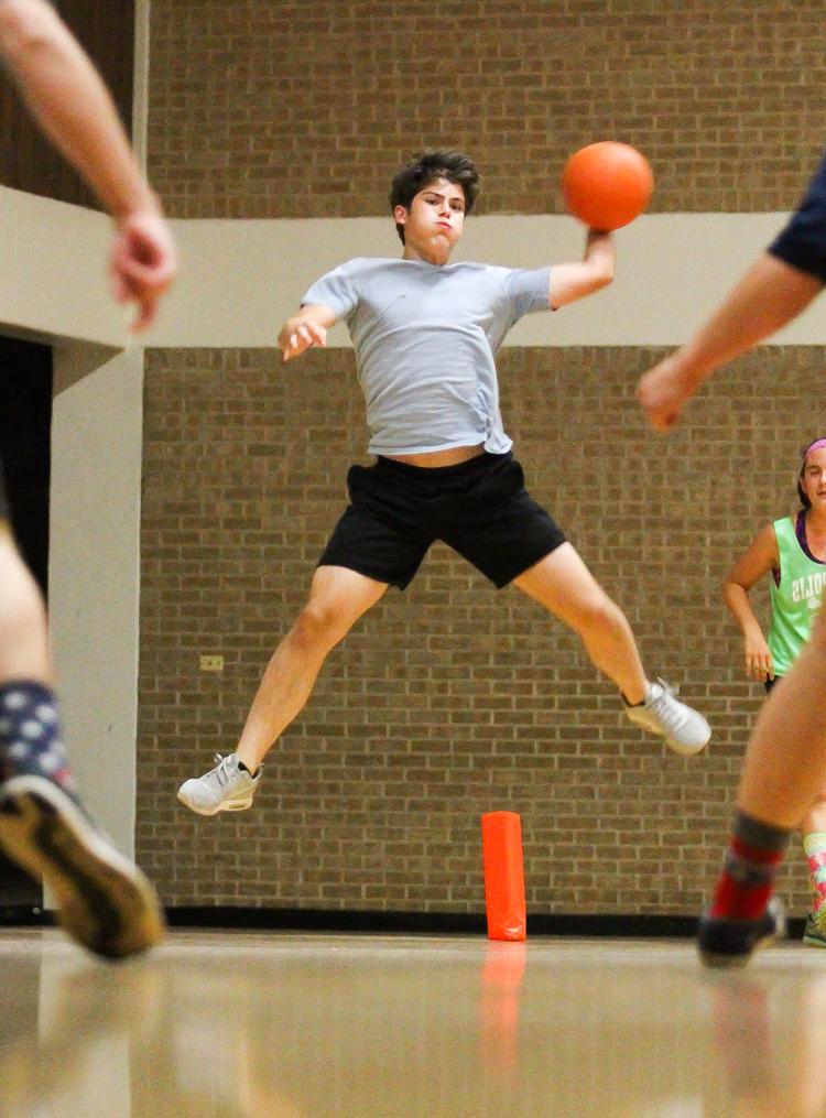 Student playing dodgeball